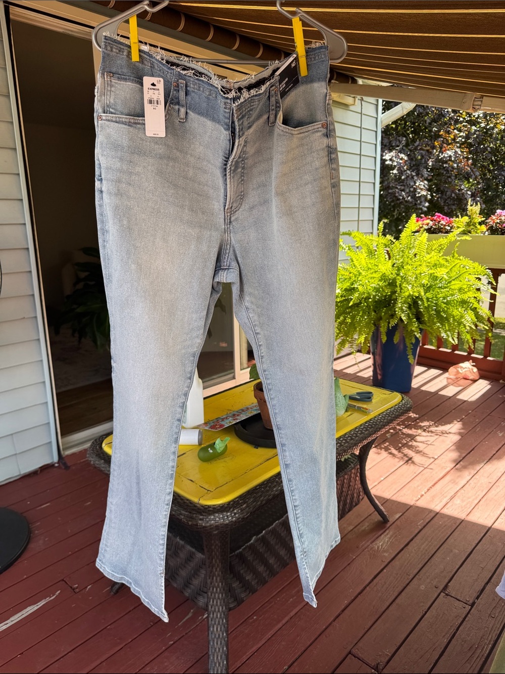 Express Light Blue Slimming Flare Jeans with Raw Frayed Waist